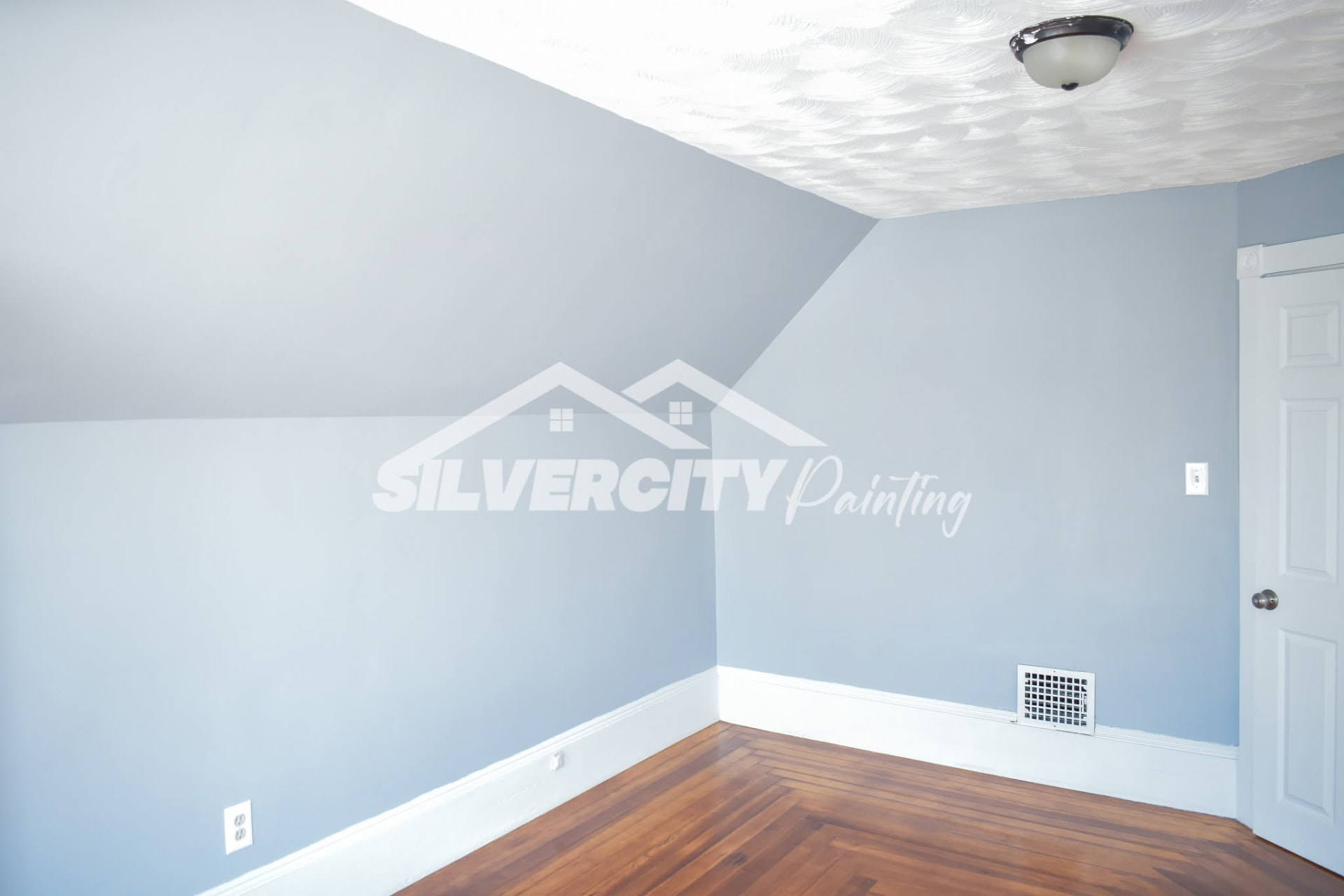 Bedroom with soft blue-grey painted walls, white trim and a textured white ceiling in Taunton, MA