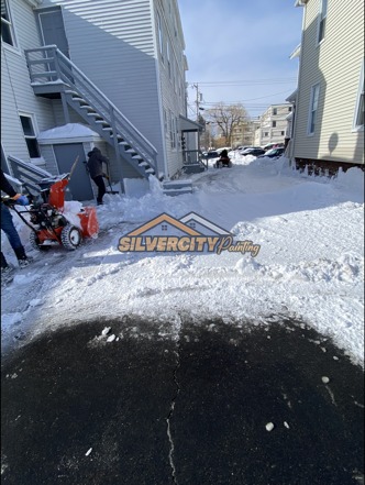 After snow clearing — open driveway cleared down to the pavement