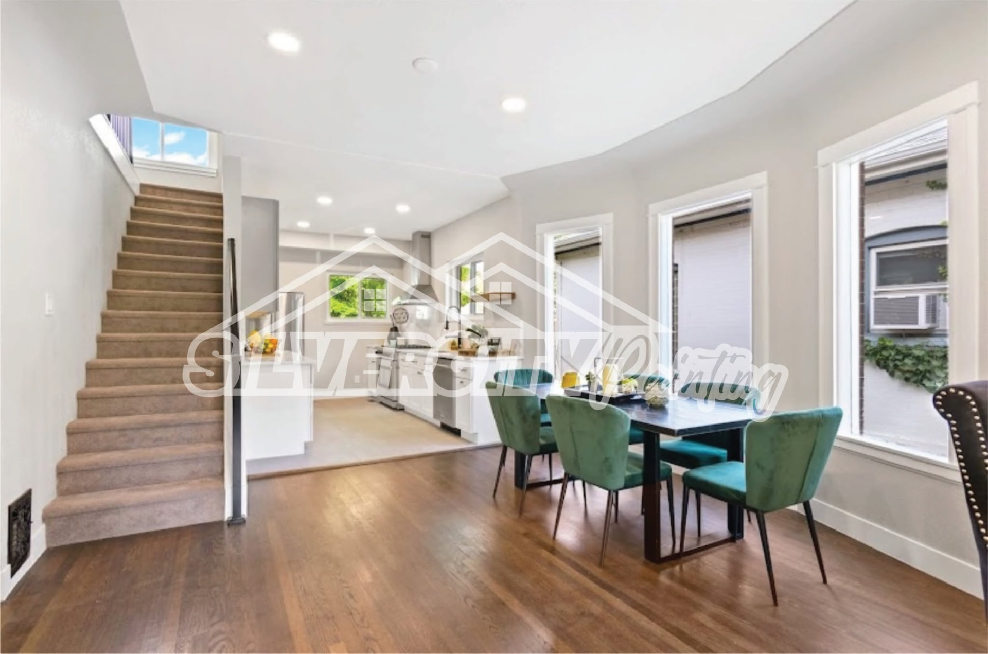 Dining room with crisp white trim and soft grey walls painted by Silver City Painting