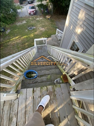 Before painting — weathered upper deck stairs, landing and railings