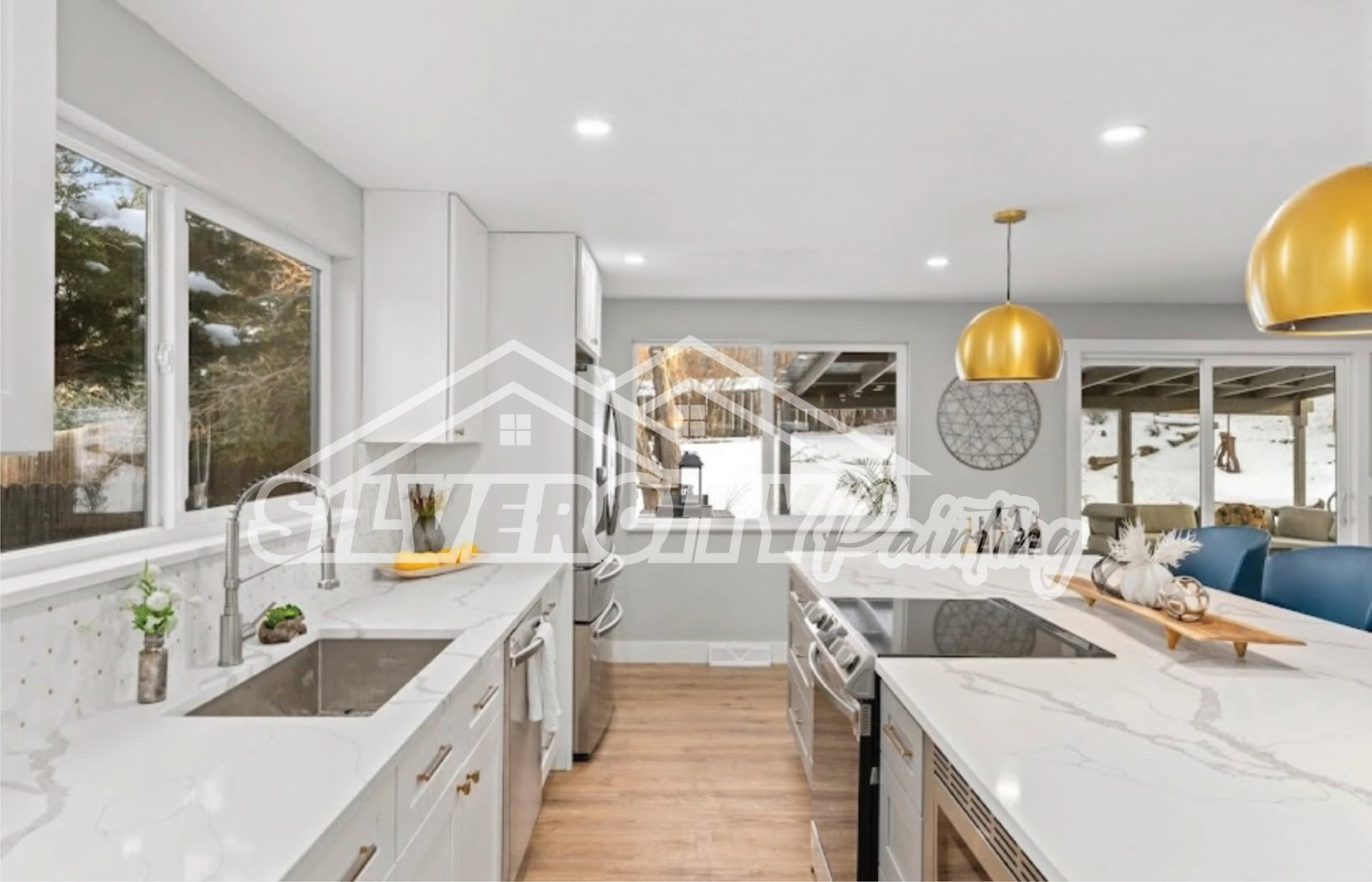 Bright white galley kitchen with painted cabinets and light grey walls in Bristol County, MA