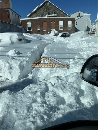 After snow clearing — wide walkway and steps cleared through deep snow